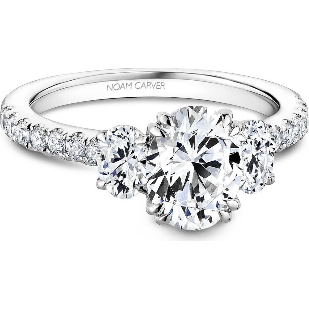 Oval-cut diamond three-stone engagement ring with pave band in white gold