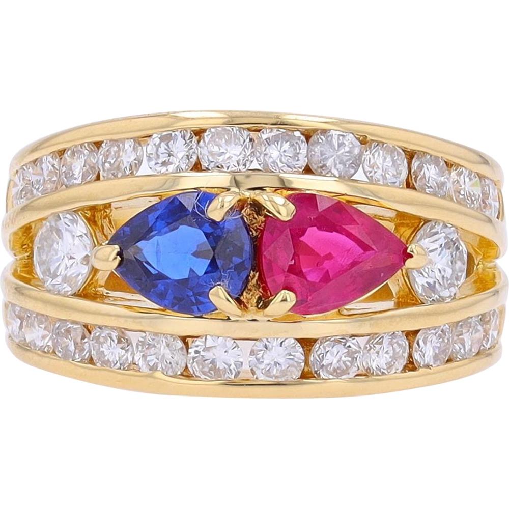 18K yellow gold ring featuring pear-shaped ruby and sapphire with diamond accents