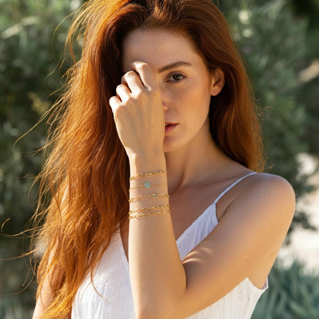 A woman's wrist adorned with various bracelets, showcasing different fits.
