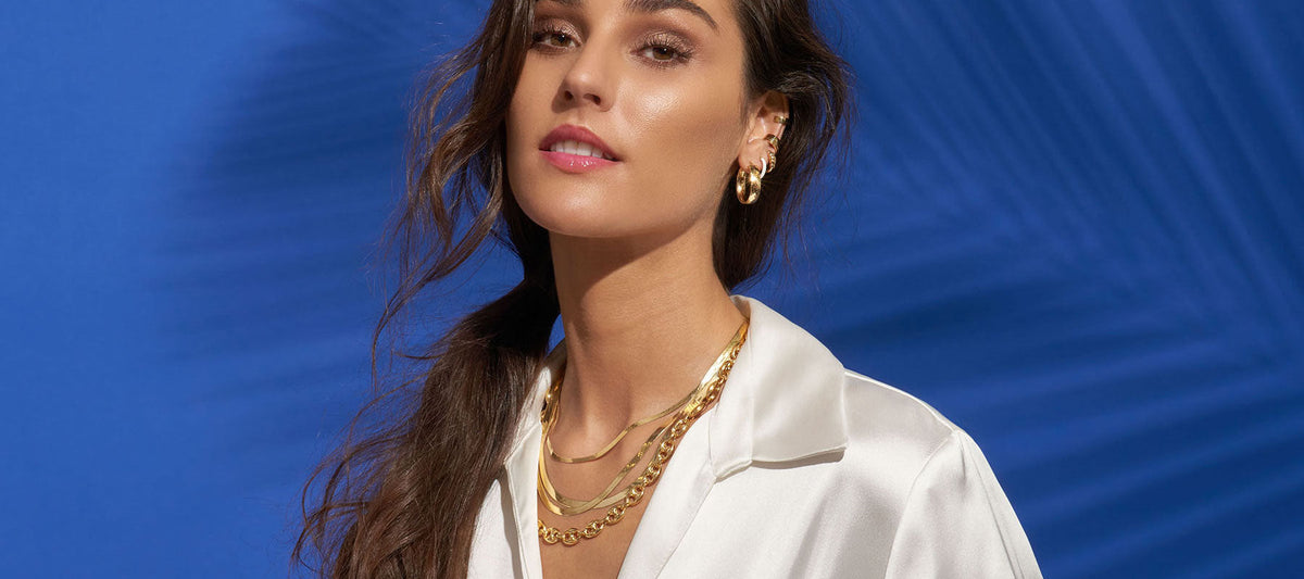 Yellow gold jewelry in style featuring necklaces, bracelets, and rings