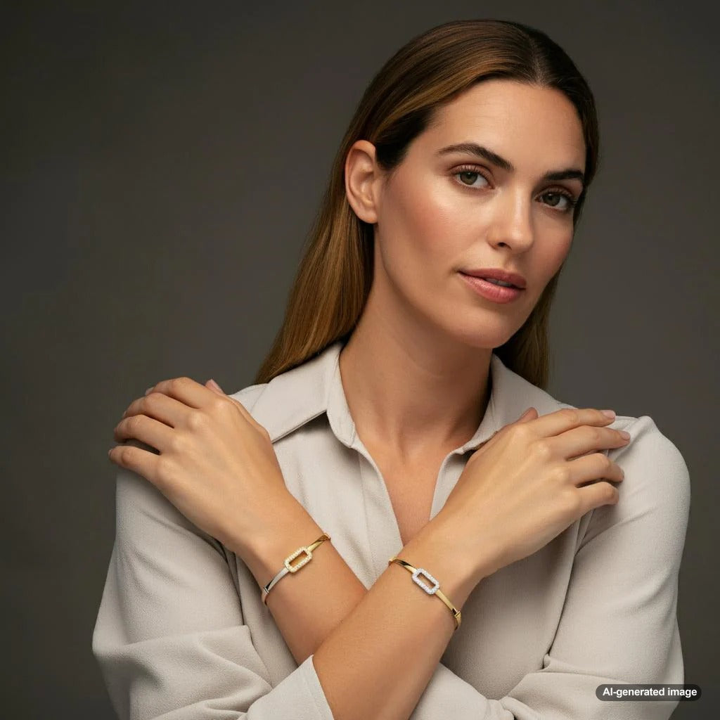 A beautiful display of two-tone jewelry pieces including rings, bracelets, and necklaces.