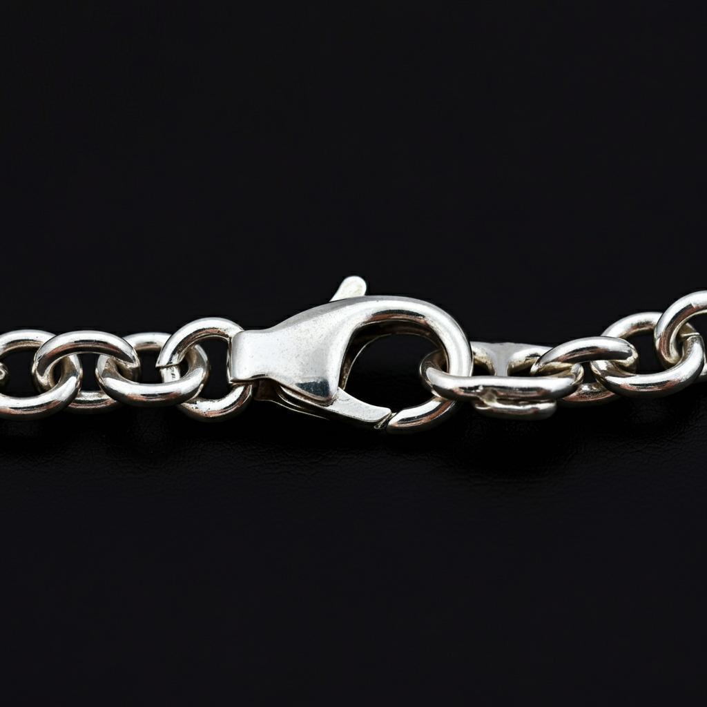 Close-up of a spring clasp and a lobster clasp showing their differences.