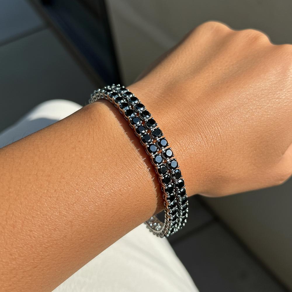 Close-up of a stunning black diamond ring with a deep, opaque luster