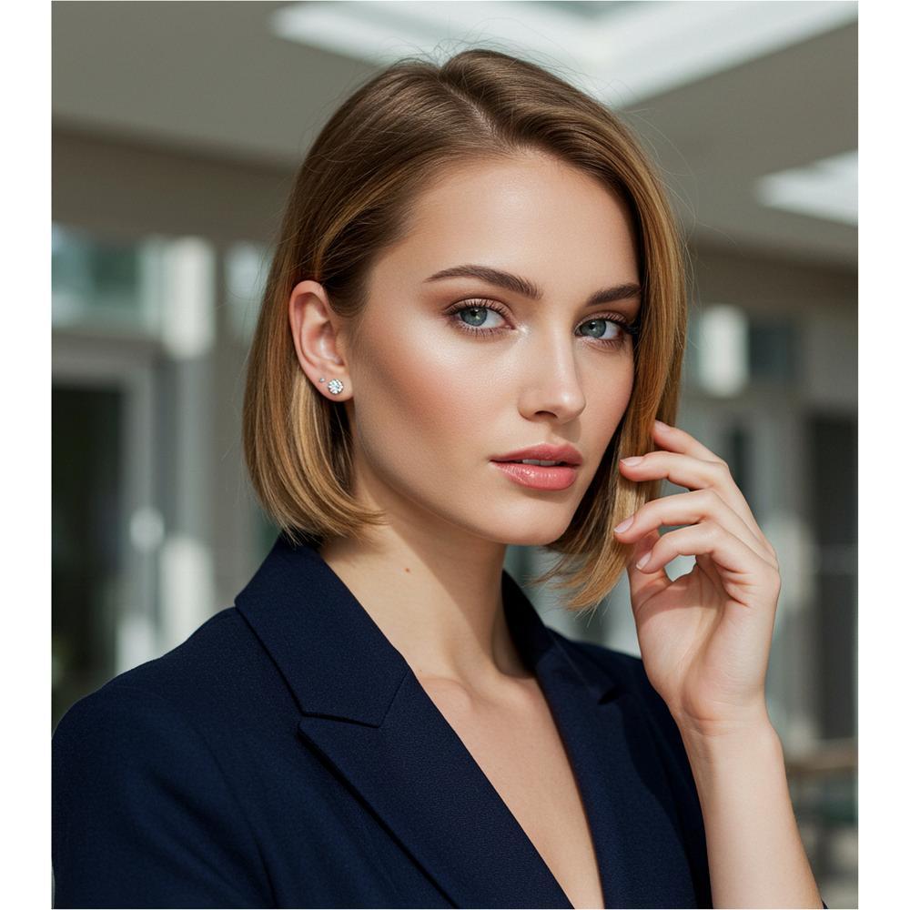 A pair of diamond stud earrings set in white gold, showcasing their timeless elegance and sparkle.