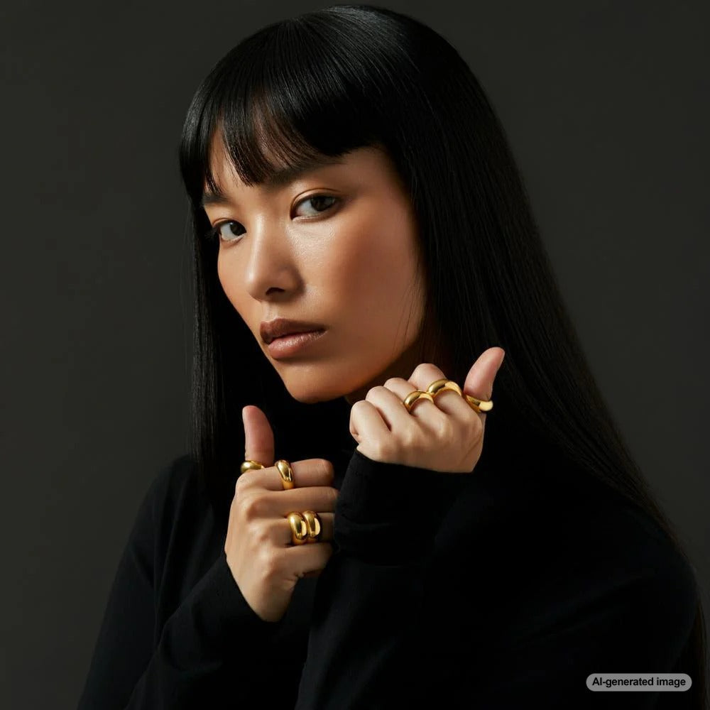 A collection of hands adorned with various rings, showcasing different styles and finger placements.