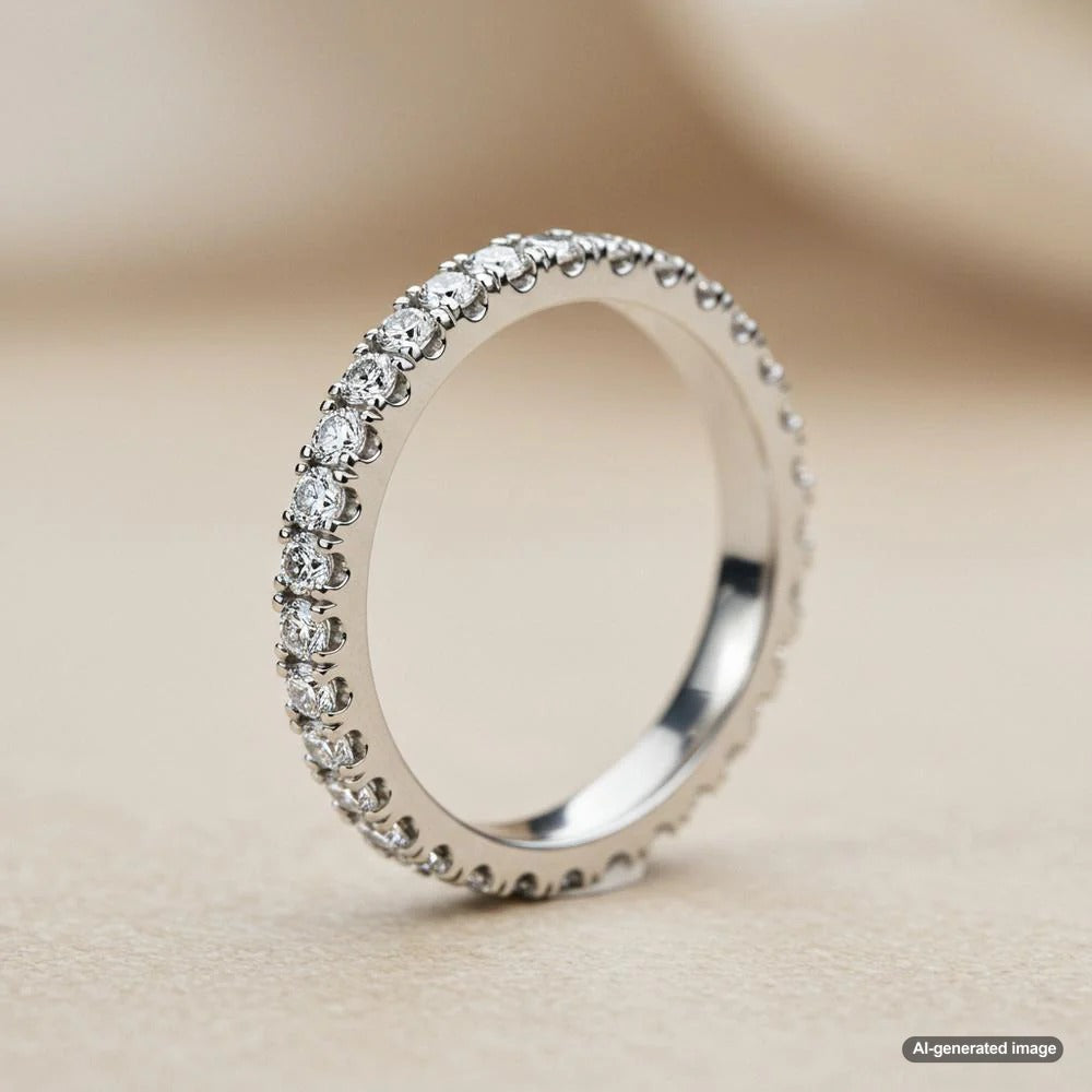 Close-up of a diamond ring with diamonds on the band, showcasing intricate details and sparkle.