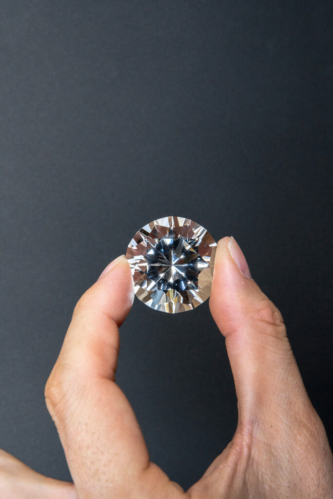 A close-up view of a diamond appraisal process showcasing the brilliance and clarity of the gem.