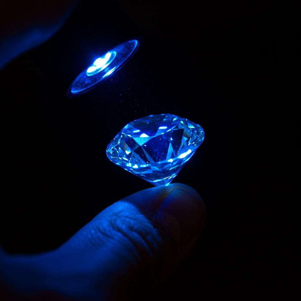Lab-grown diamonds exhibiting fluorescence under UV light
