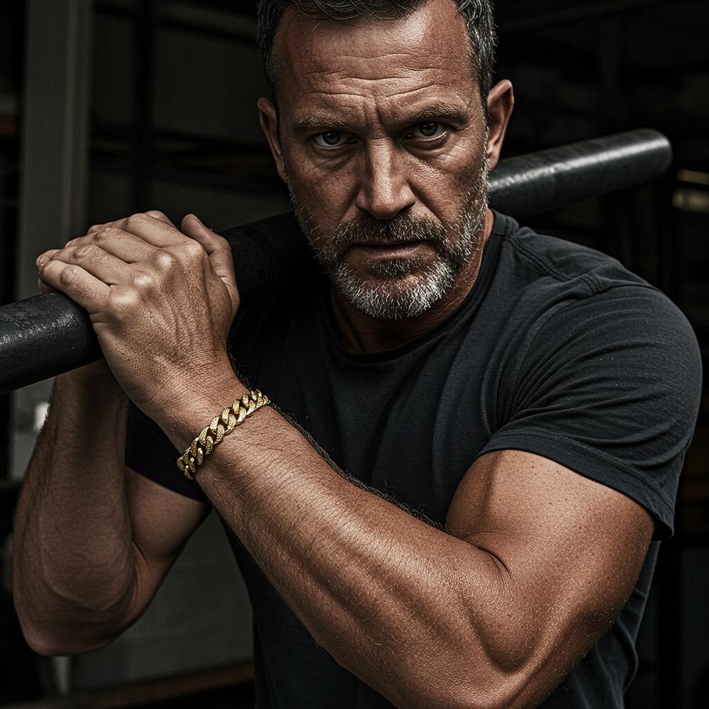 A rugged yet stylish man wearing a bold Cuban link bracelet from Robinson's Jewelers