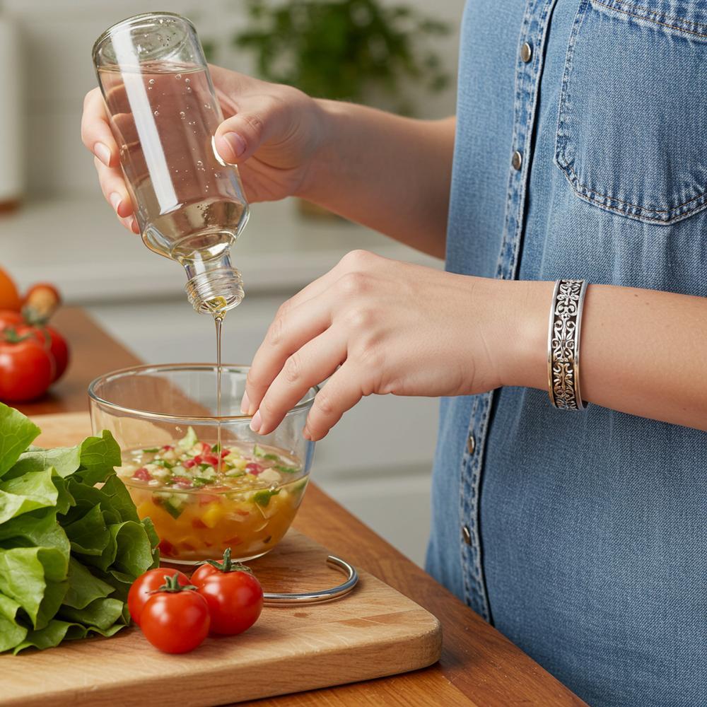 Sterling silver jewelry tarnishing in vinegar, showing the effects of oxidation on silver