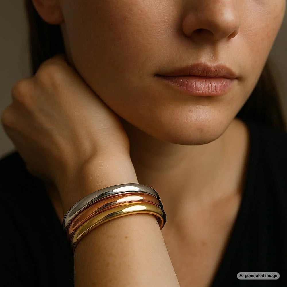 Elegant multi-tone gold jewelry pieces showcasing yellow, white, and rose gold combinations in rings, bracelets, and necklaces