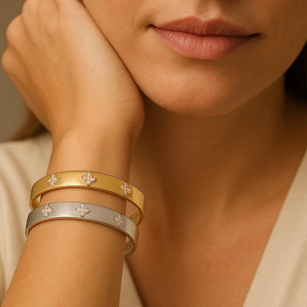 Elegant gold clover bracelet with intricate detailing, symbolizing luck and prosperity