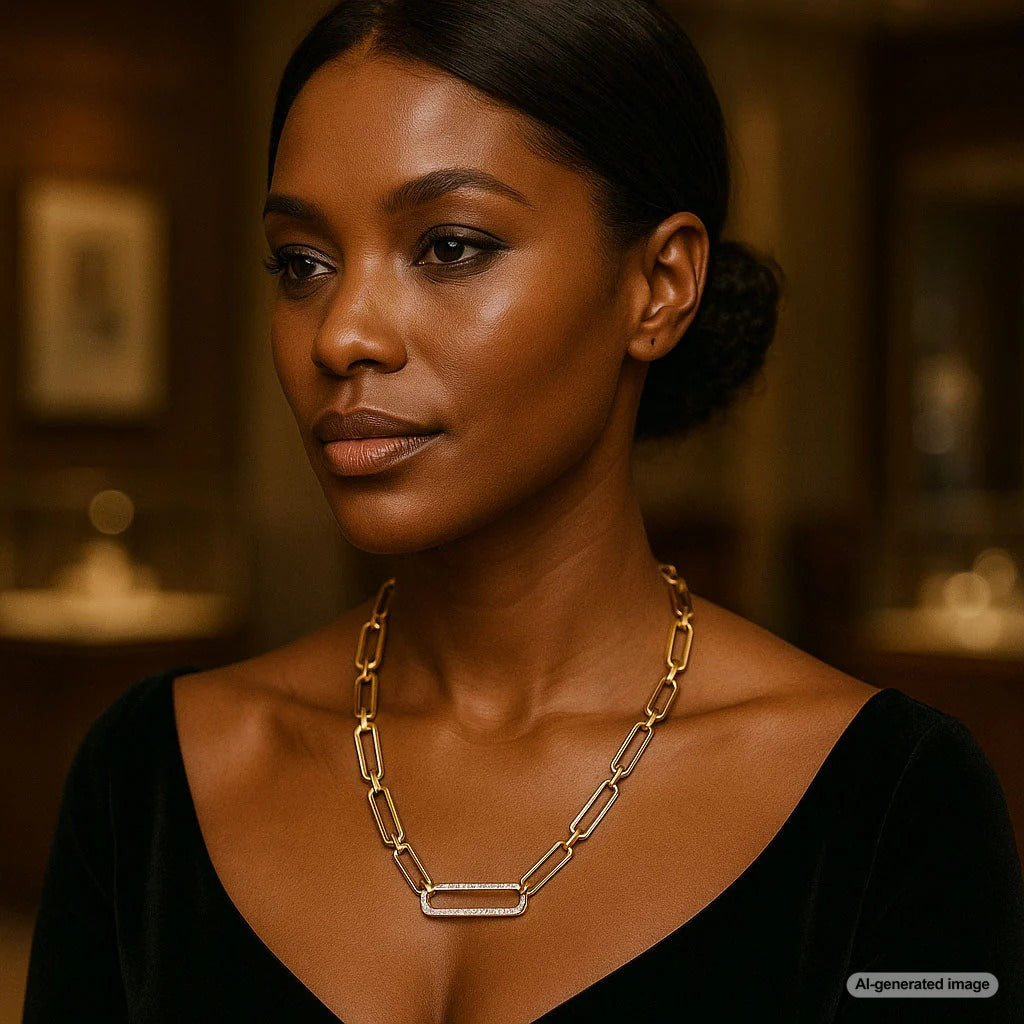 Luxury gold paper clip chain necklace displayed elegantly on a jewelry stand