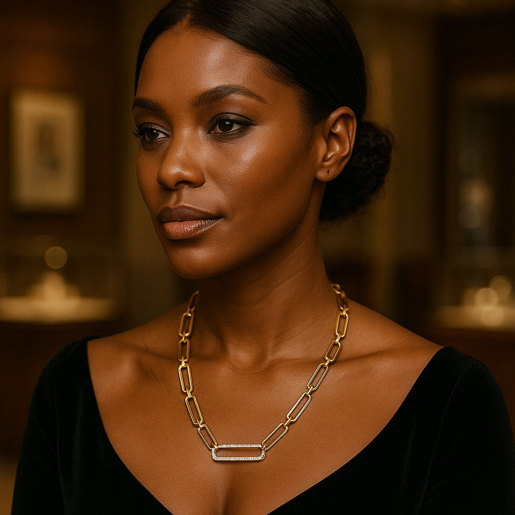 Luxury gold paper clip chain necklace displayed elegantly on a jewelry stand