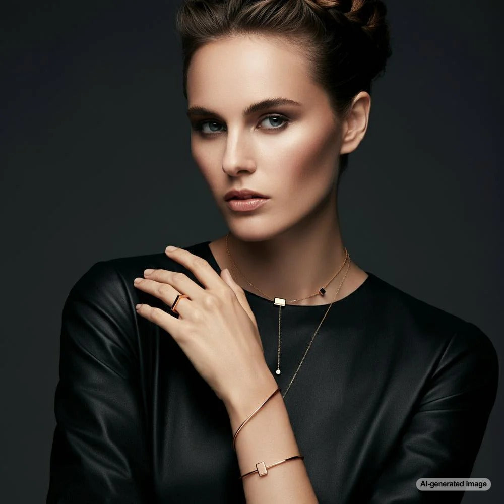 A woman elegantly adorned with layered necklaces and stackable rings, showcasing how jewelry complements personal style.