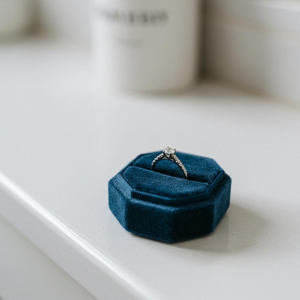 Close-up of a sparkling engagement ring being inspected by a jeweler