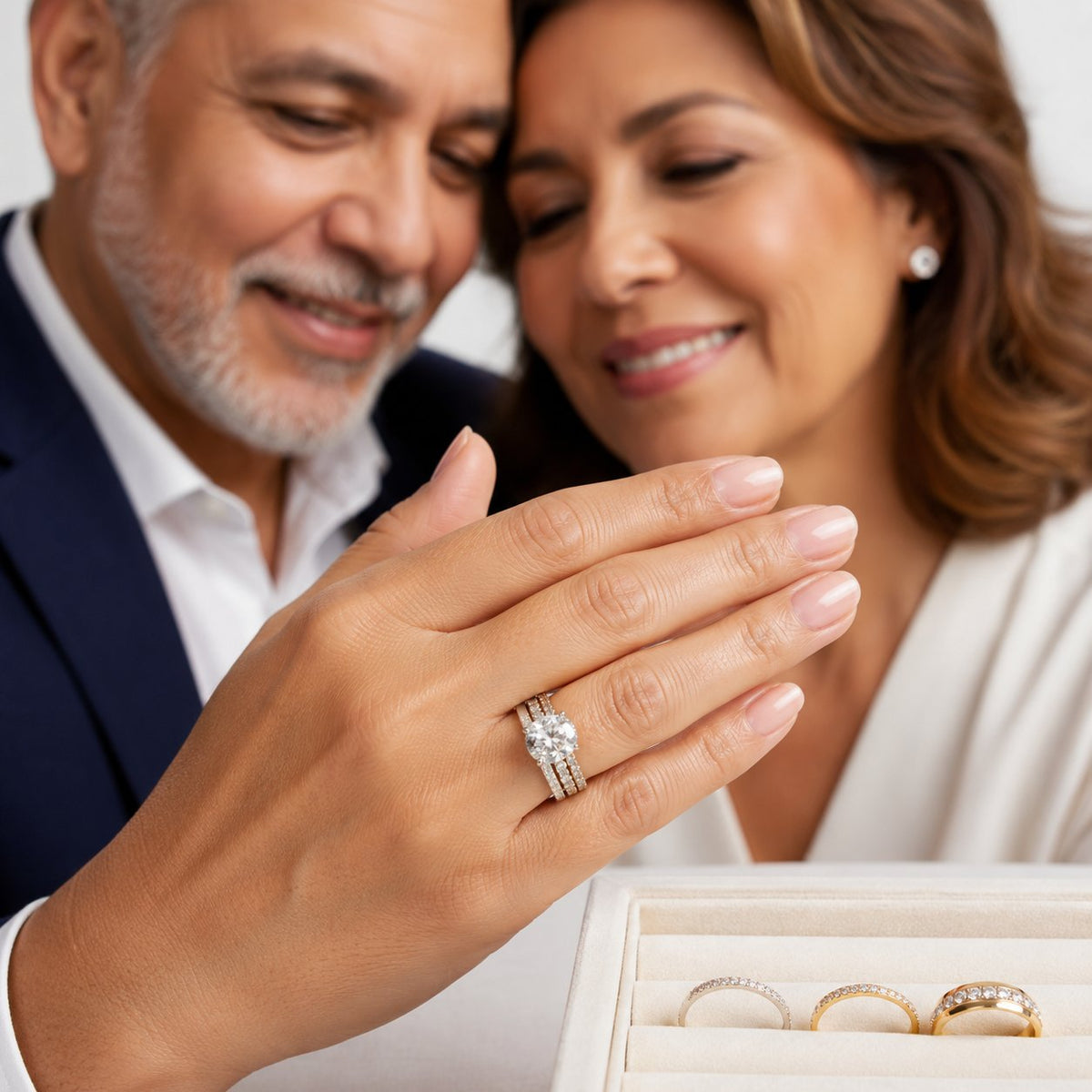 A woman's hand showing an engagement ring paired with a contoured wedding band that sits flush without any gap