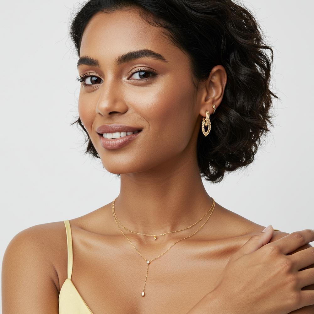 Elegant jewelry selections for olive skin tones, featuring gold and gemstone pieces