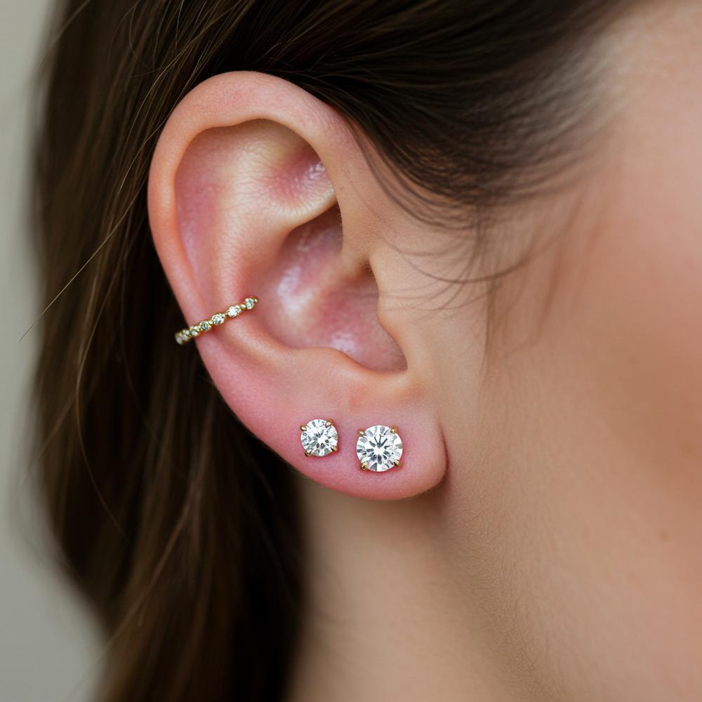 Elegant diamond stud earrings in various sizes displayed on a velvet tray