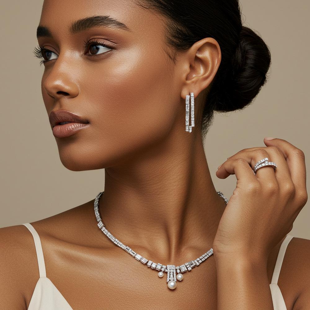 A beautifully styled mix of white gold and platinum rings, bracelets, and necklaces.