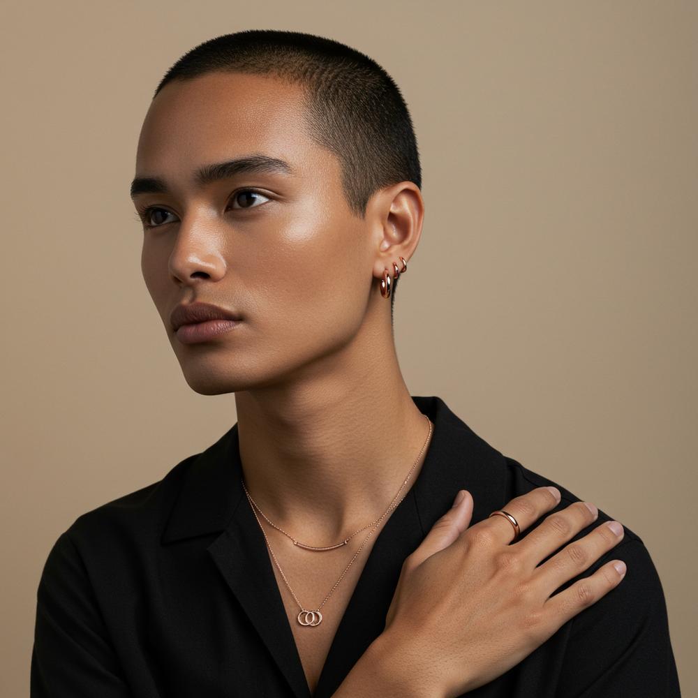 A collection of elegant rose gold jewelry, including rings, necklaces, and bracelets, displayed on a soft velvet background.
