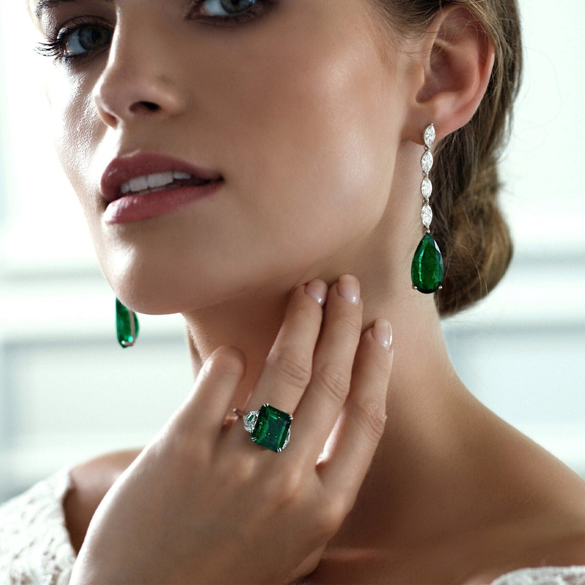 Stunning emerald ring with diamonds, capturing the lush green elegance of May's birthstone.