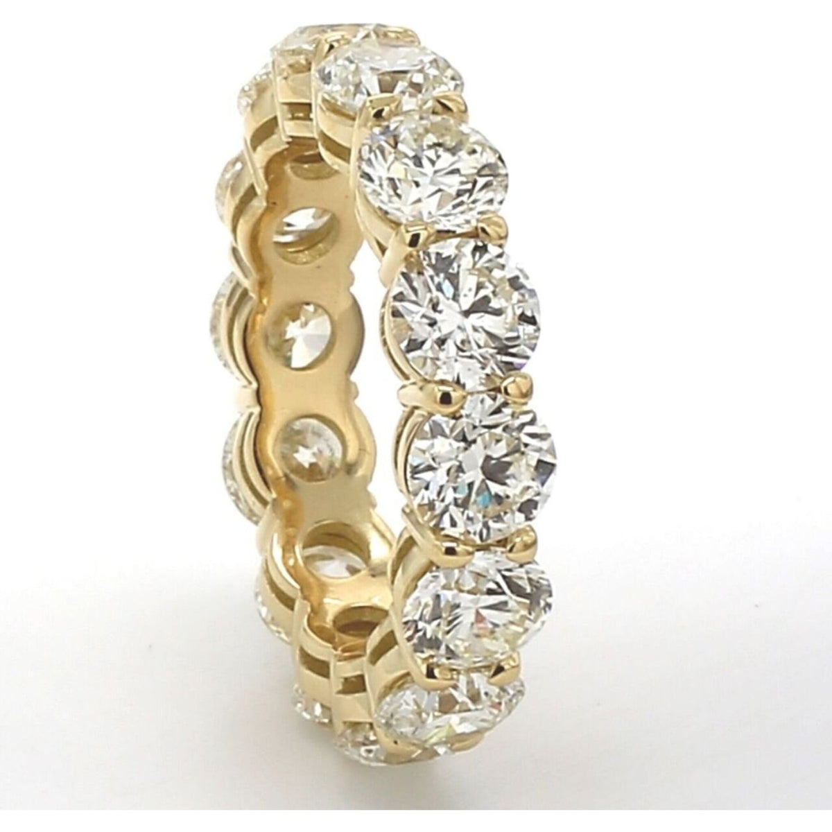 Ninacci 18K Yellow Gold Eternity Band with basket-prong set round diamonds, a 7.03 carat total diamond weight, available at Robinson's Jewelers