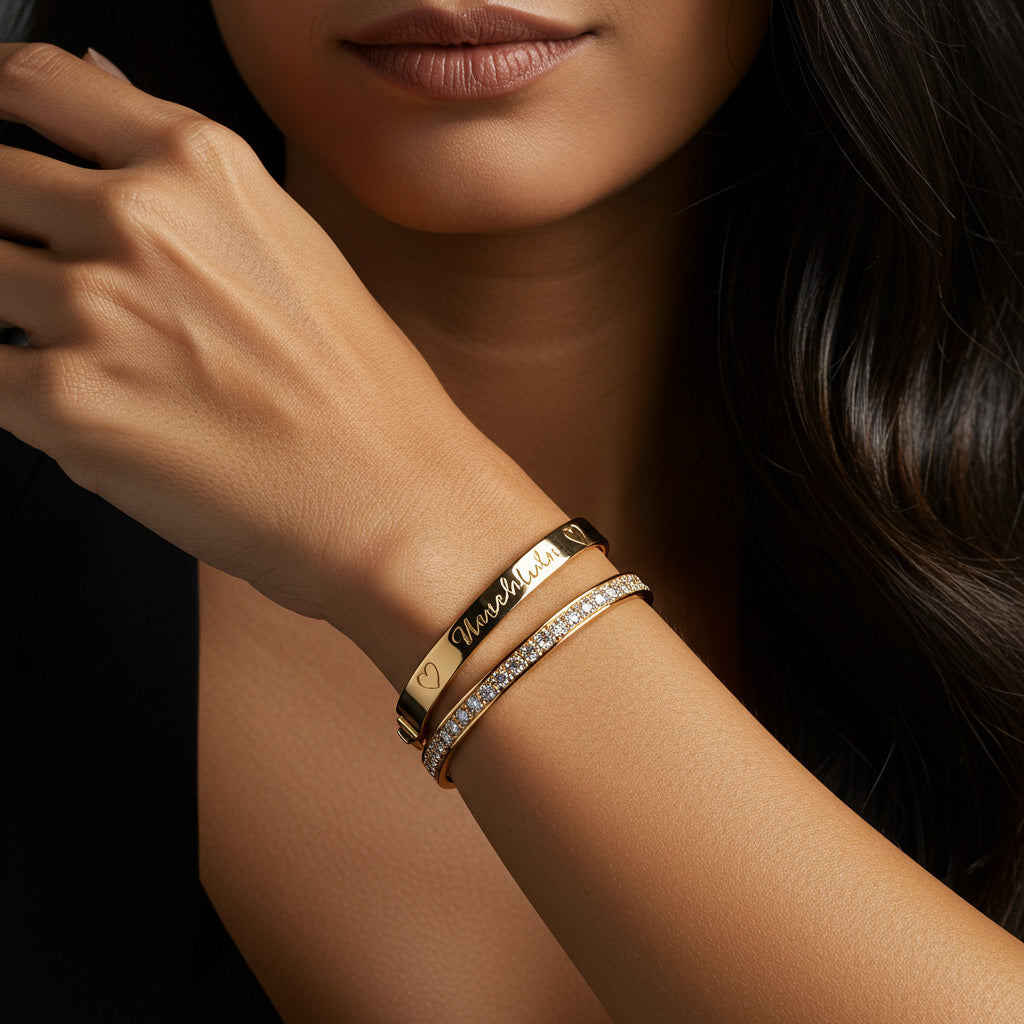 Personalized bracelets with engraved charms and nameplates displayed elegantly on velvet