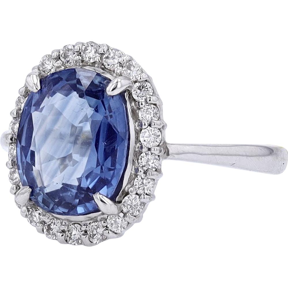 Platinum oval 3.62 carat Ceylon sapphire and diamond halo ring