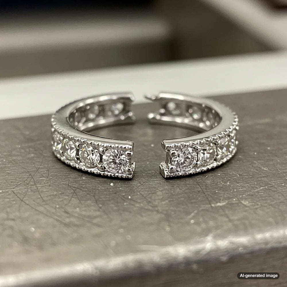 Professional jeweler repairing an elegant diamond ring at Robinson's Jewelers workbench