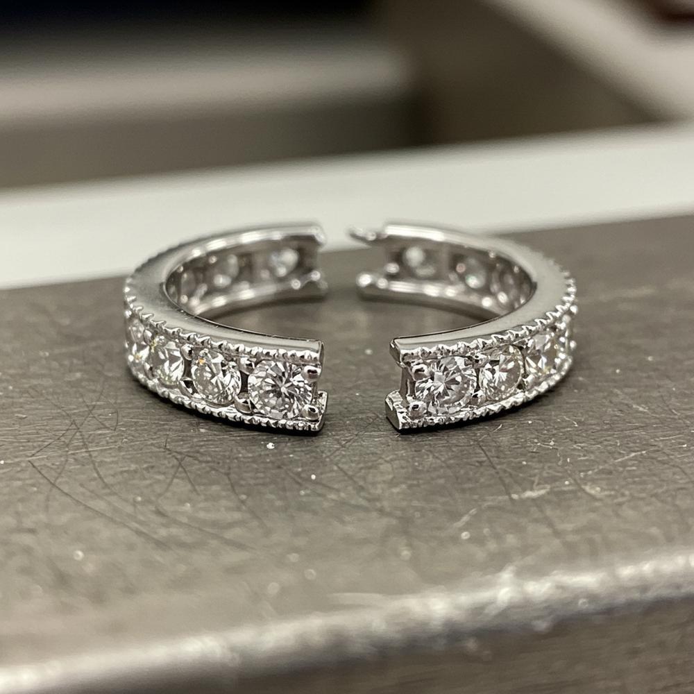 Professional jeweler repairing an elegant diamond ring at Robinson's Jewelers workbench