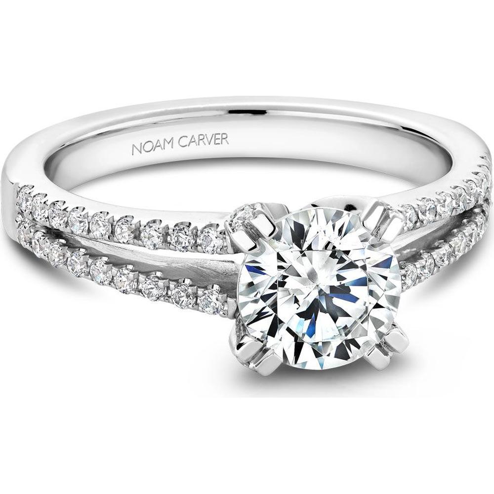 Round-cut diamond engagement ring with split band and pave diamonds in white gold