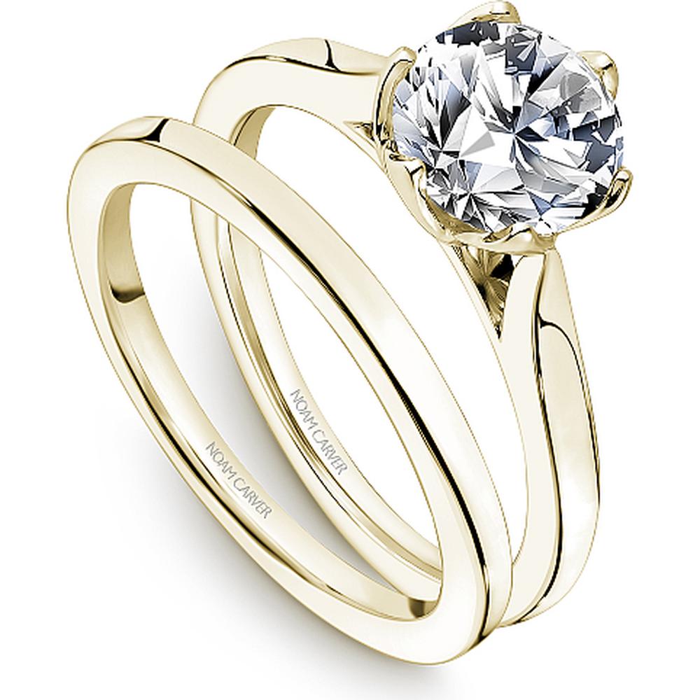 Round cut diamond solitaire engagement ring with six prong setting in yellow gold by Noam Carver