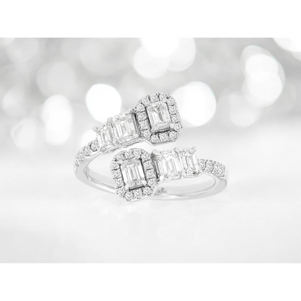 14k white gold bypass ring with emerald-cut diamonds and round halo accents