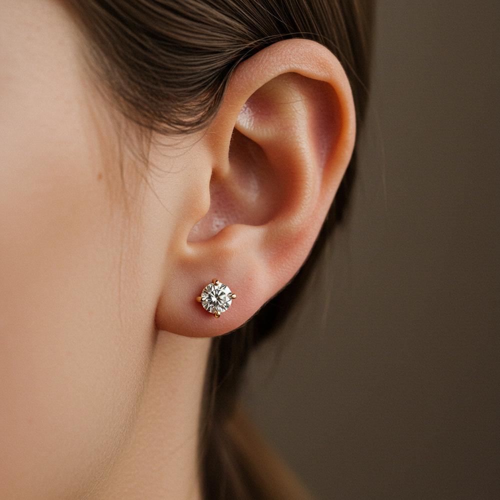 Woman sleeping with earrings on a nightstand