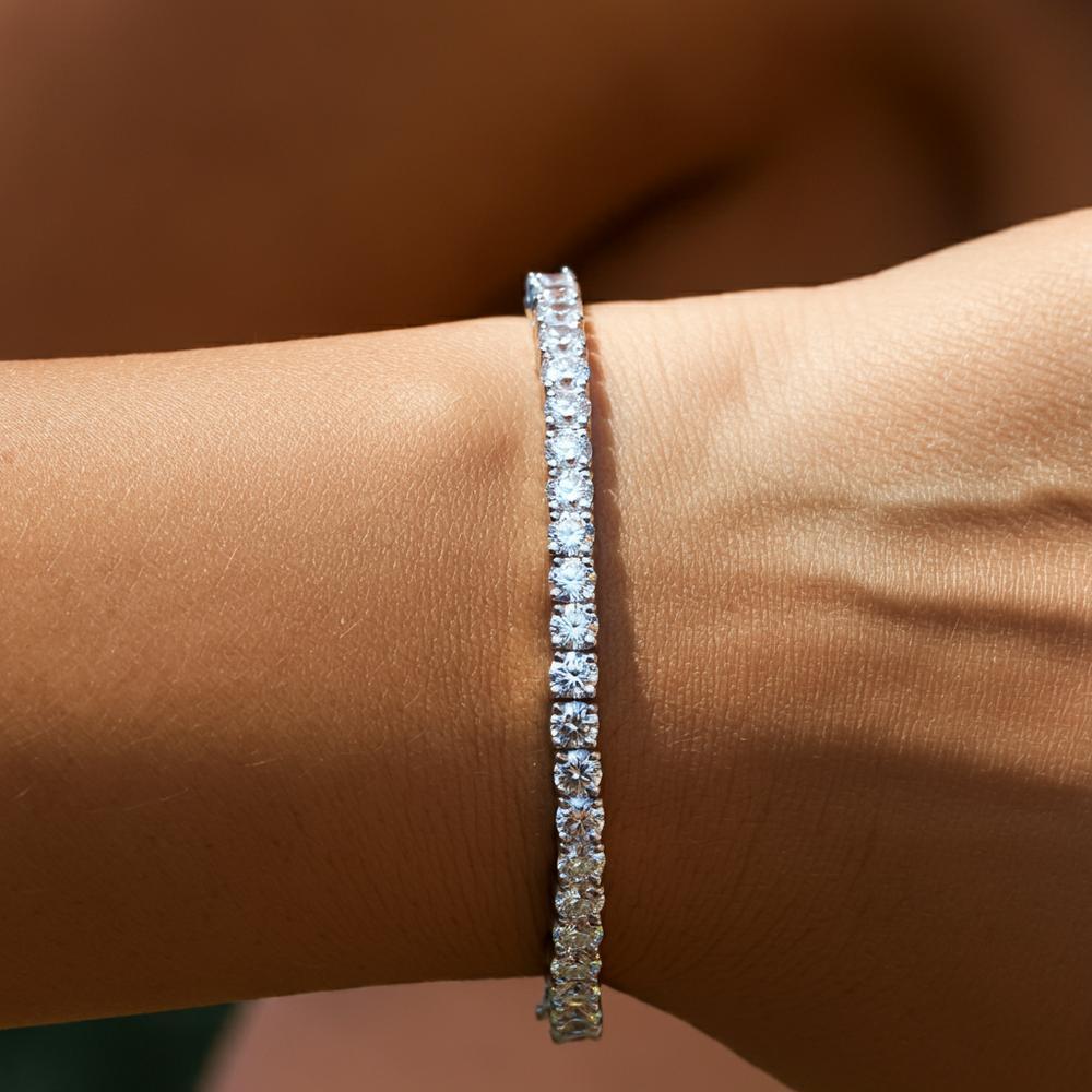 Woman wearing a diamond tennis bracelet with a perfect fit