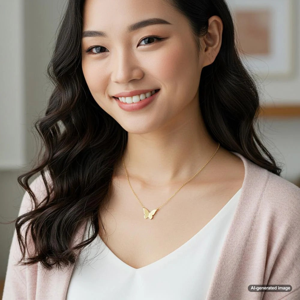Elegant gold butterfly necklace with intricate detailing, perfect for any occasion.