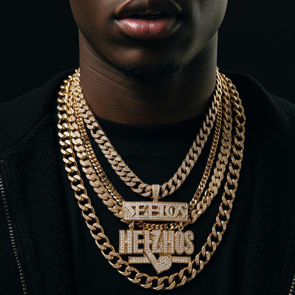Vintage gold hip-hop chains displayed on black velvet with diamond pendants