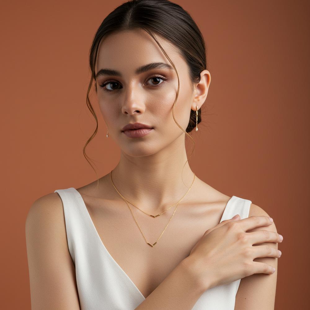 Elegant minimalist jewelry pieces including delicate rings, bracelets, and necklaces on a neutral background