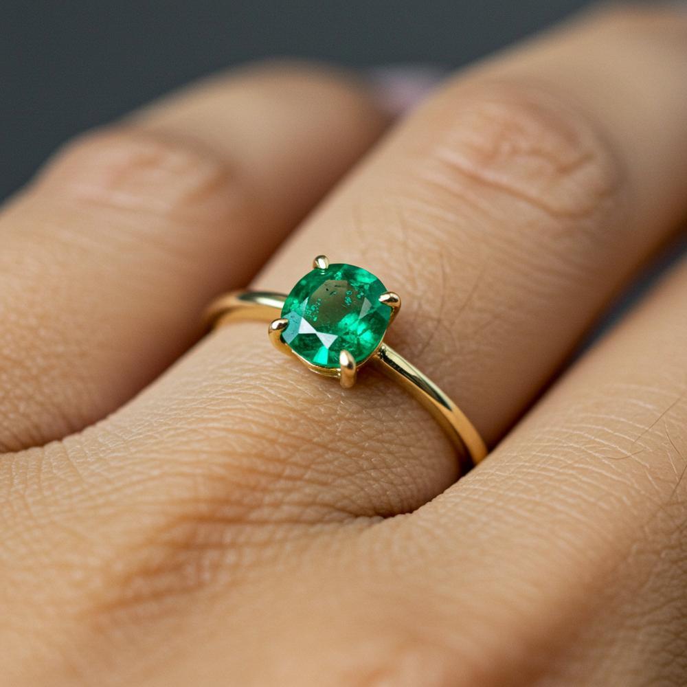 Close-up of various gemstones showing unique inclusions that affect their value and beauty