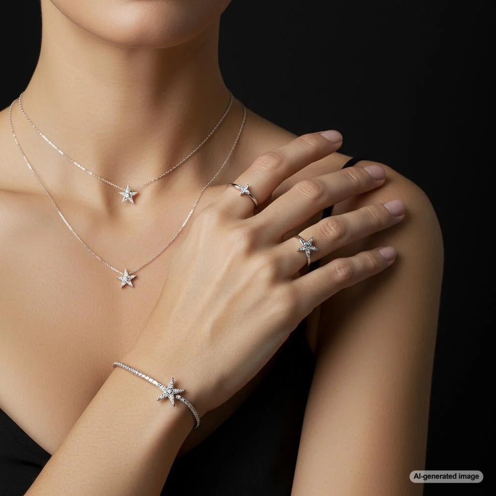 Elegant star-shaped jewelry pieces including necklaces, rings, and earrings displayed on velvet
