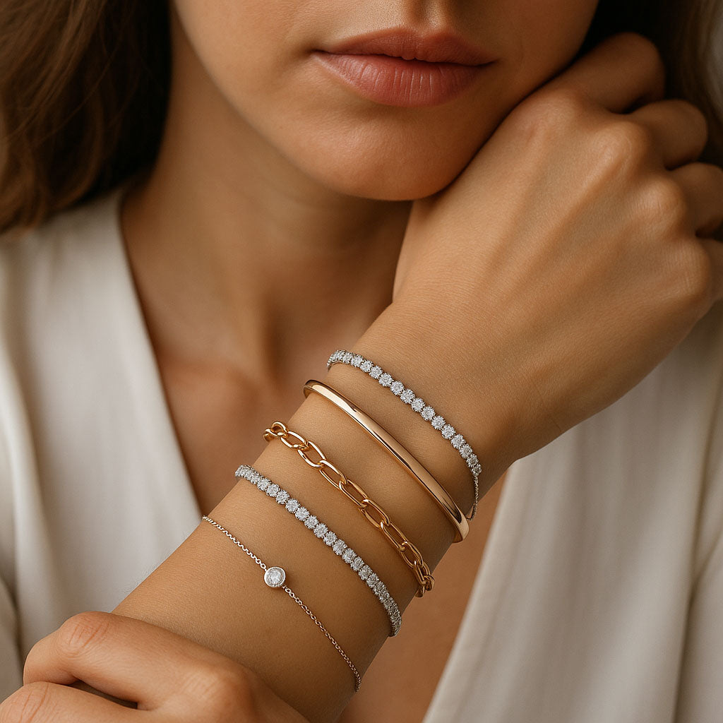An elegant assortment of bracelets including tennis bracelets, bangles, and charm bracelets displayed at Robinson's Jewelers