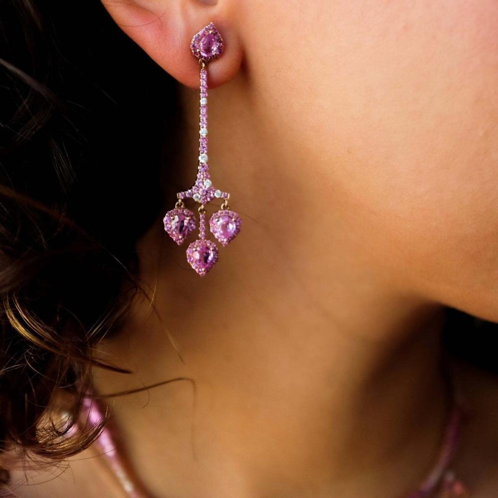 Elegant pink sapphire ring with intricate detailing, symbolizing love and grace