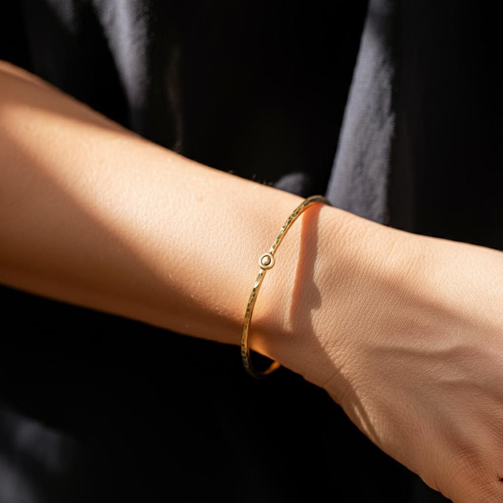 Woman wearing a bracelet on her right wrist