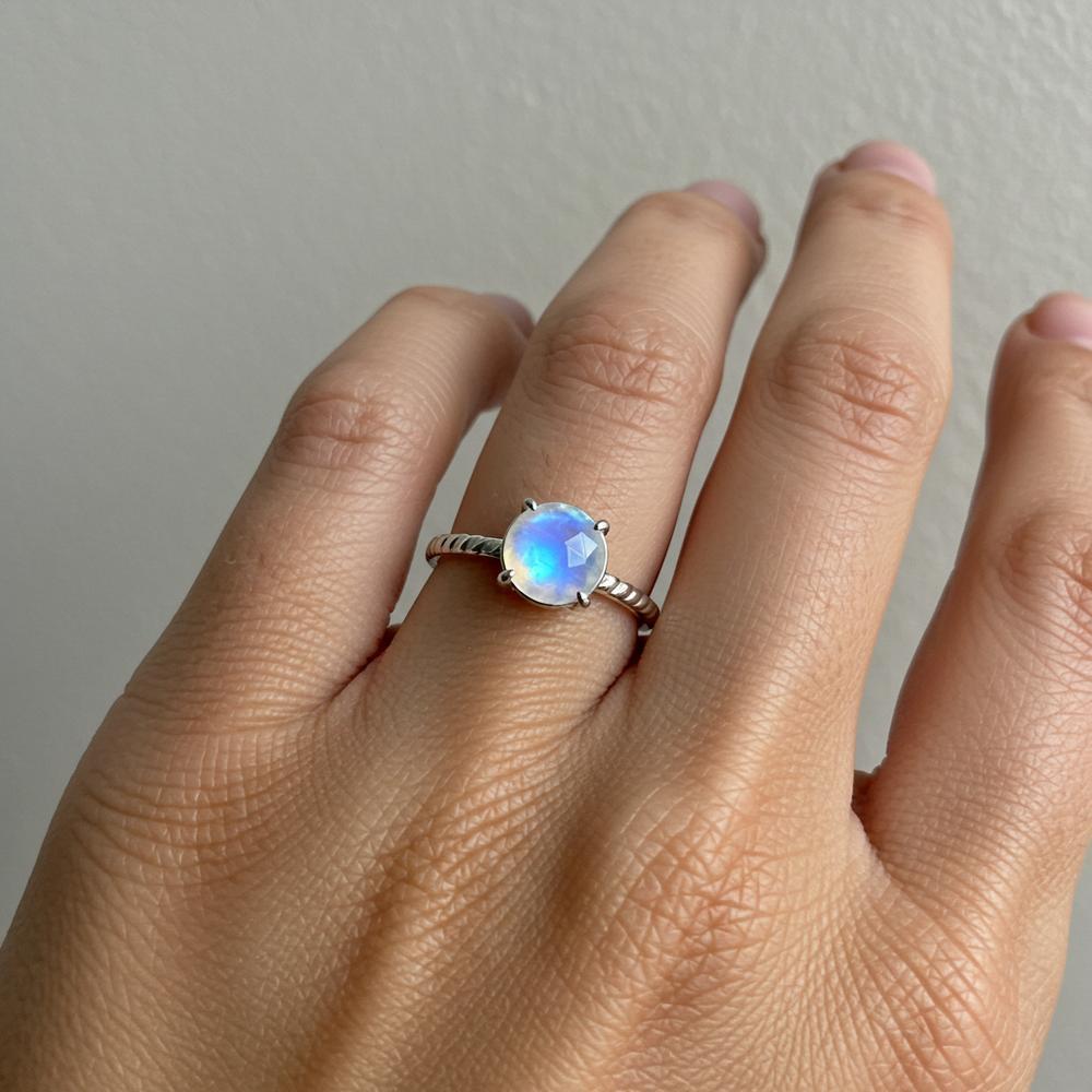 A stunning moonstone gemstone catching the light, showcasing its ethereal blue sheen and mystical allure.