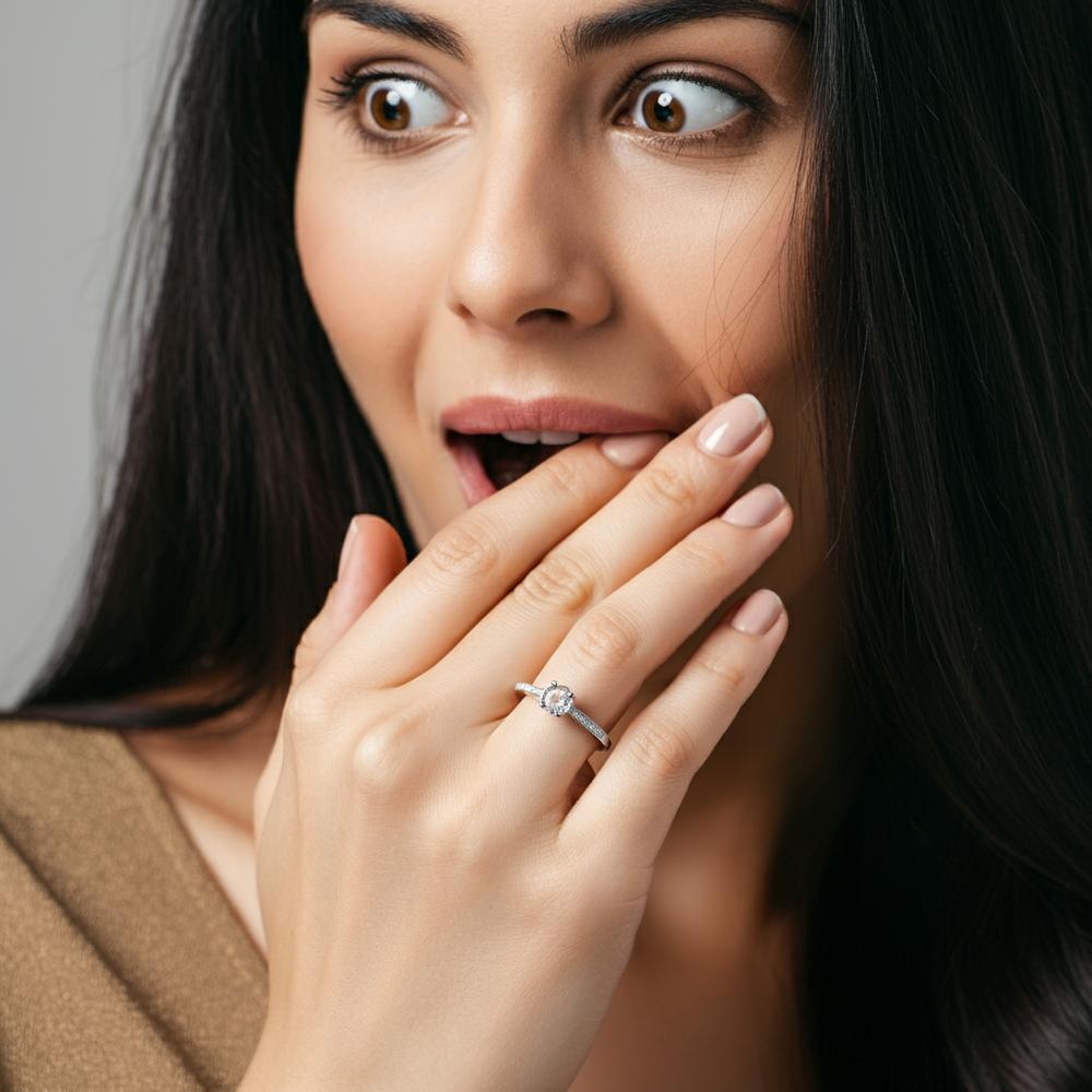 Close-up of a ring missing its central gemstone