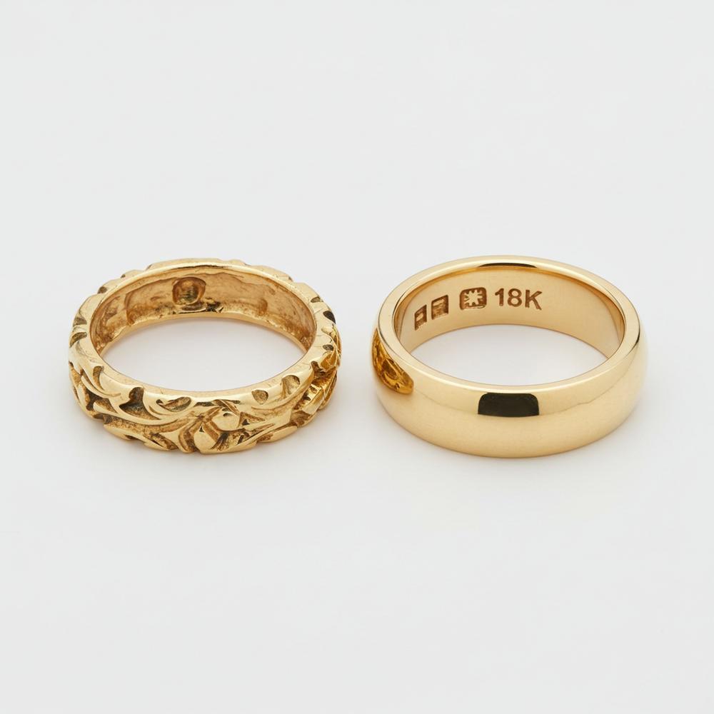 Close-up of unstamped gold jewelry with a magnifying glass