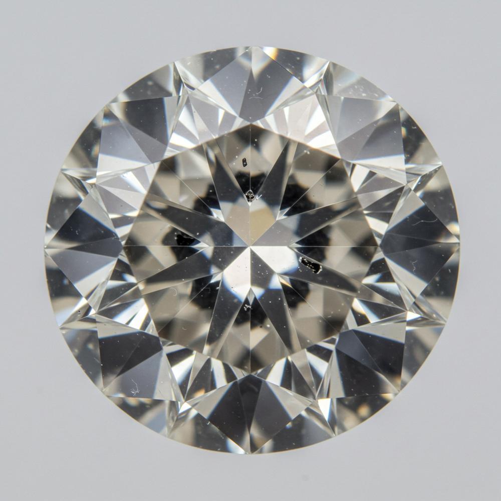 Close-up of a diamond showing various types of inclusions under magnification