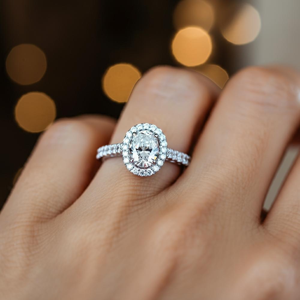 Various diamond sizes displayed on a hand for comparison