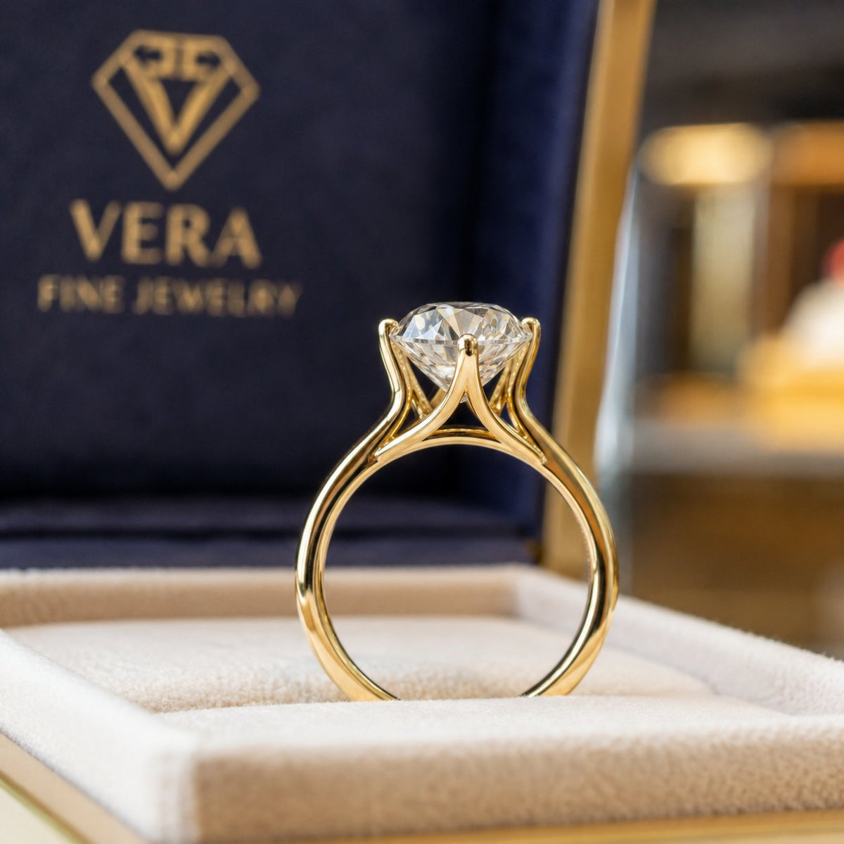 Elegant Cathedral Solitaire Engagement Ring showcasing raised diamond setting on a gold band